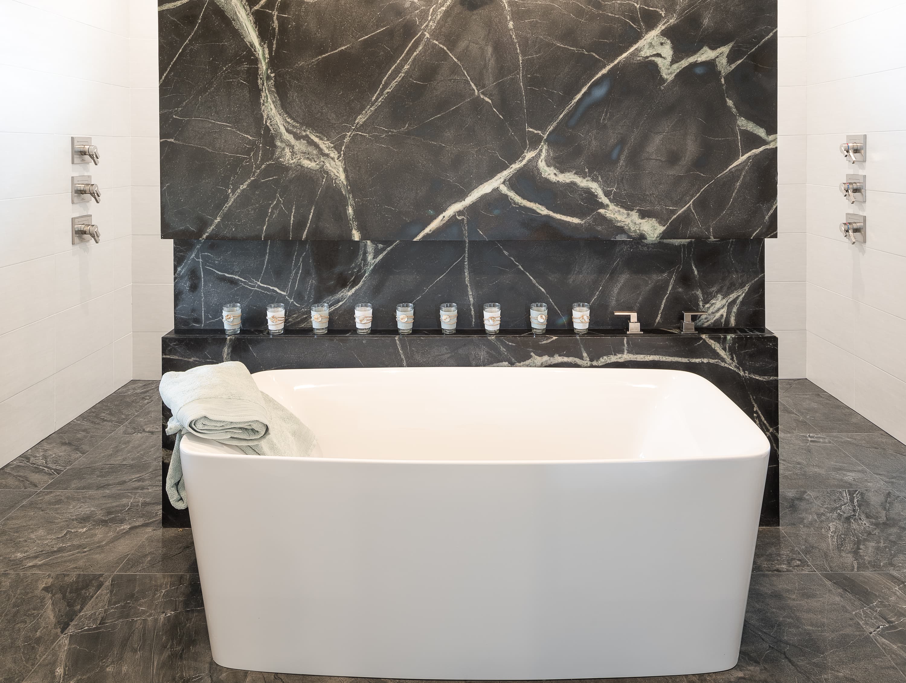 Dramatic dark marble feature wall and floor