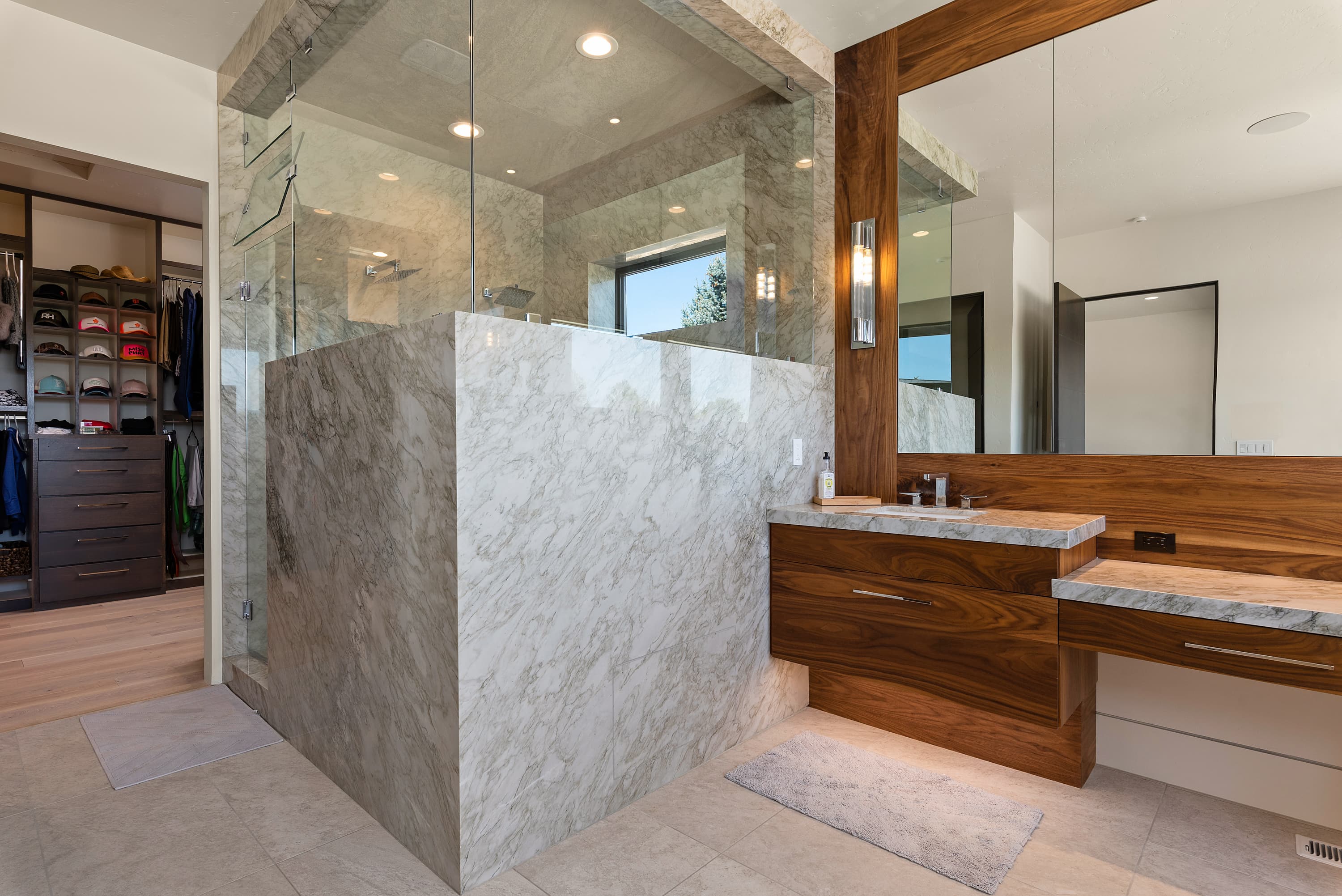 Full marble shower surround and floating vanity